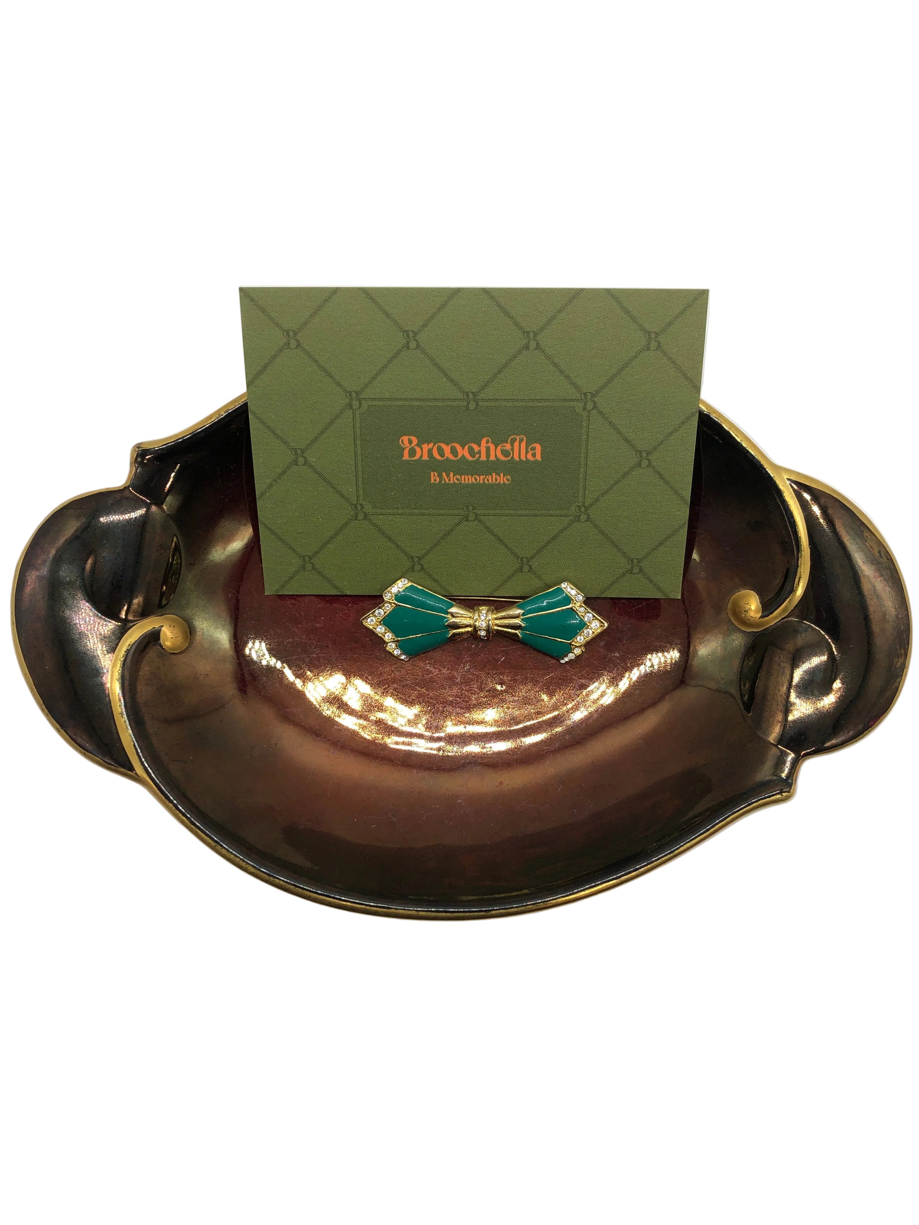 Vintage emerald enamel bow brooch with crystal detailing in gold tone, Paris-sourced designer style accessory