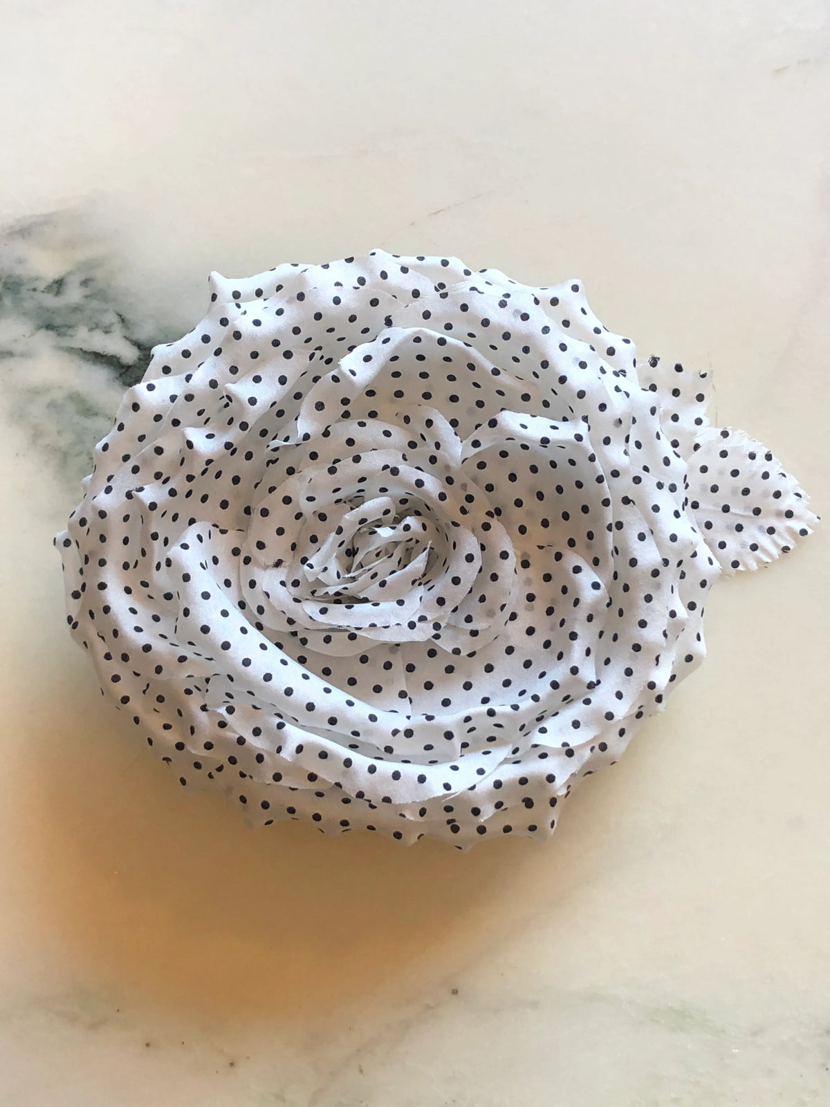 Broochella Dalmata Men's Flower Brooch Pin in white with black polka dots, featuring sculpted layered fabric petals in a statement rose design.