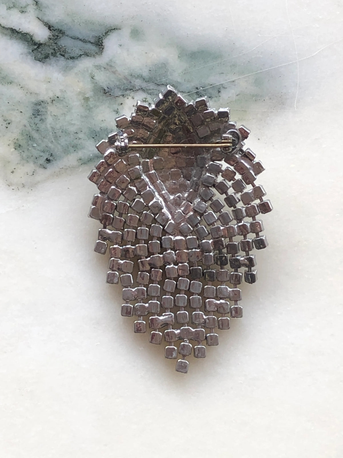 Broochella Vittoria vintage crystal cascade brooch, reverse view showing the openwork metal setting and pin fastening.